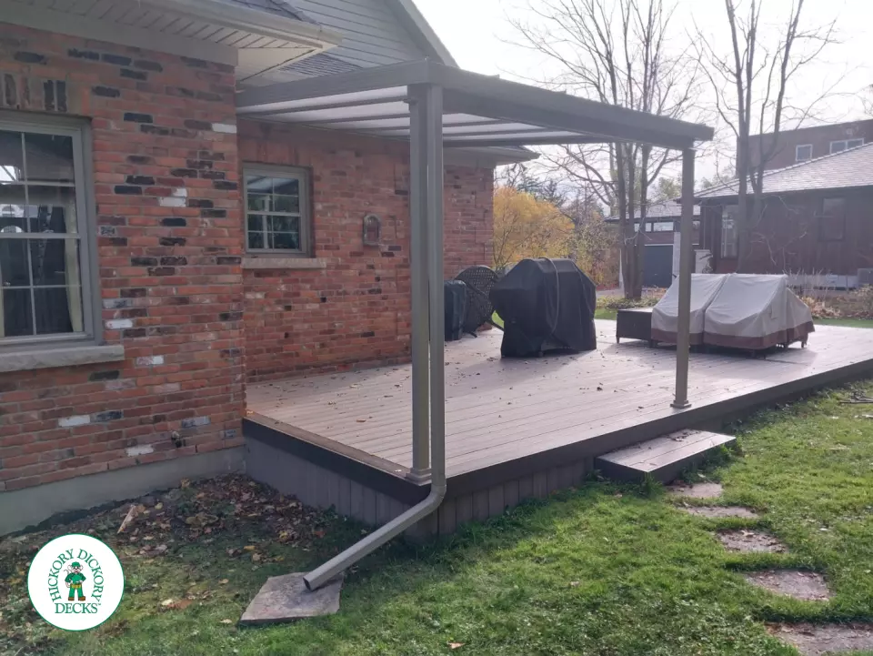 Grey deck with dark grey trim and a sunspace roof structure.