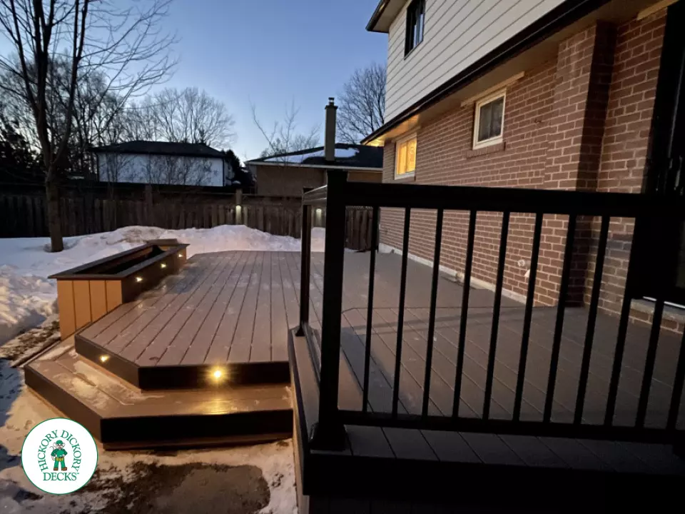 Brown clubhouse deck with lighting in steps.
