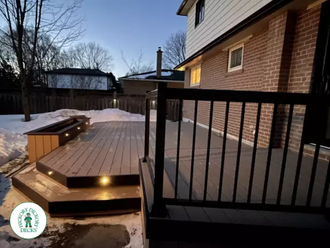 Brown clubhouse deck with lighting in steps.