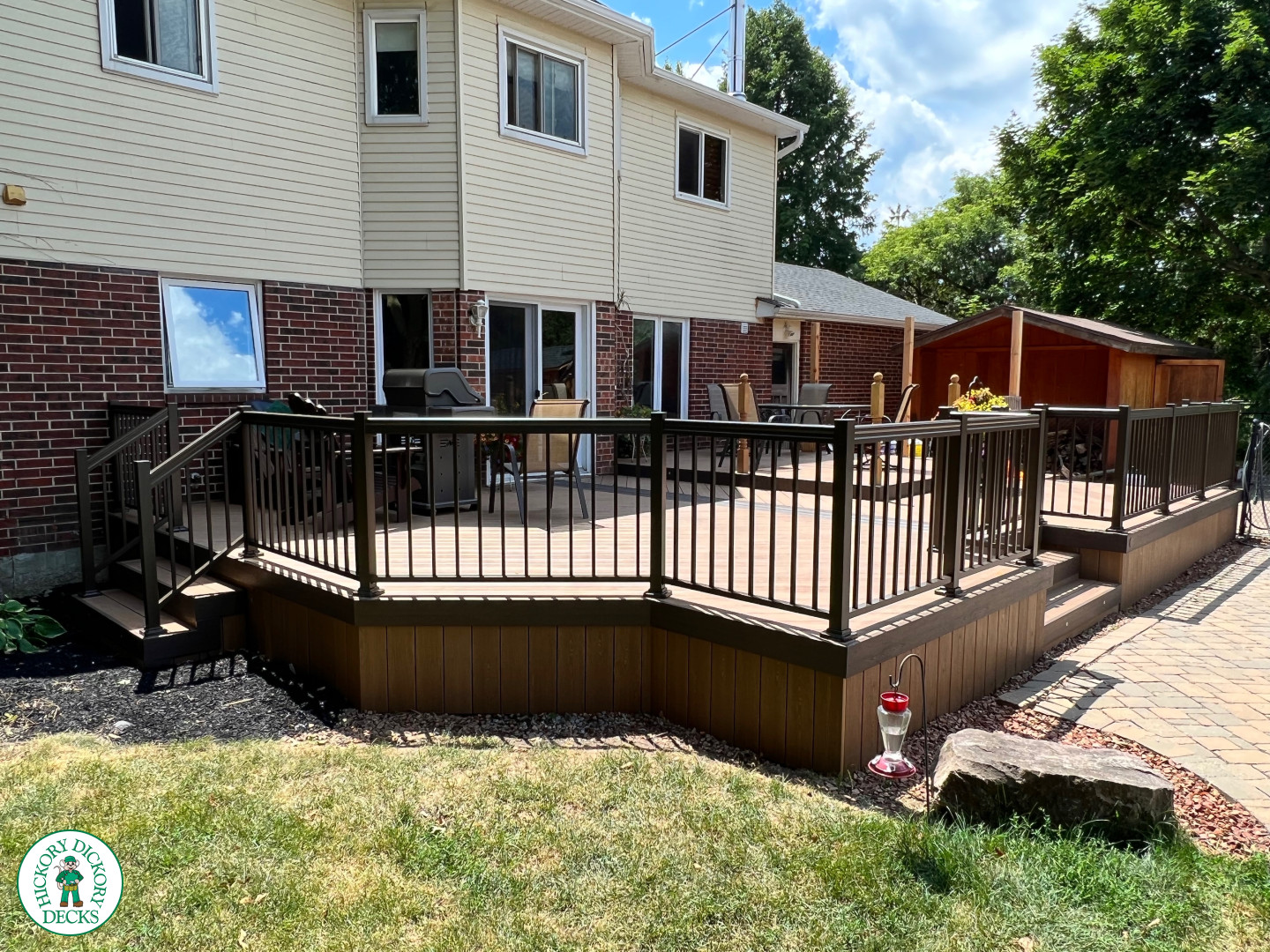 Clubhouse deck with aluminum railing with gate insert for access.