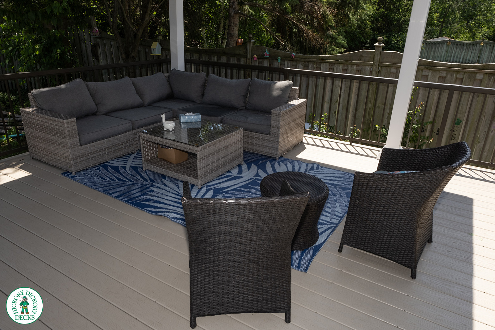 Large brown deck surrounding an above ground pool