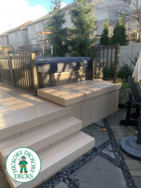 Azek Deck built around a hot tub with privacy screens and aluminum railings, Waterloo, Ontario