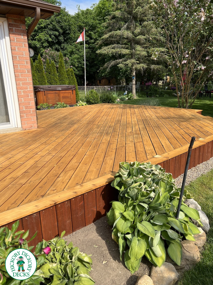 Large cedar deck with stairs, aluminum railing, and a cedar privacy screen.