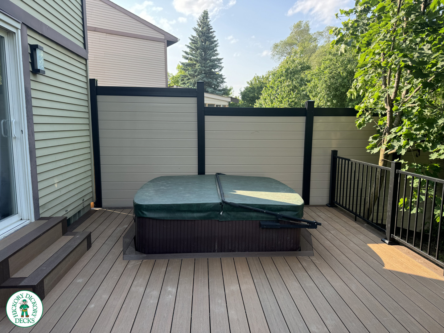 Clubhouse hot tub deck with privacy screens in Ottawa