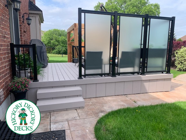 Slate grey Azek deck with large privacy screens, a pergola and aluminum rails, Kitchener, Ontario