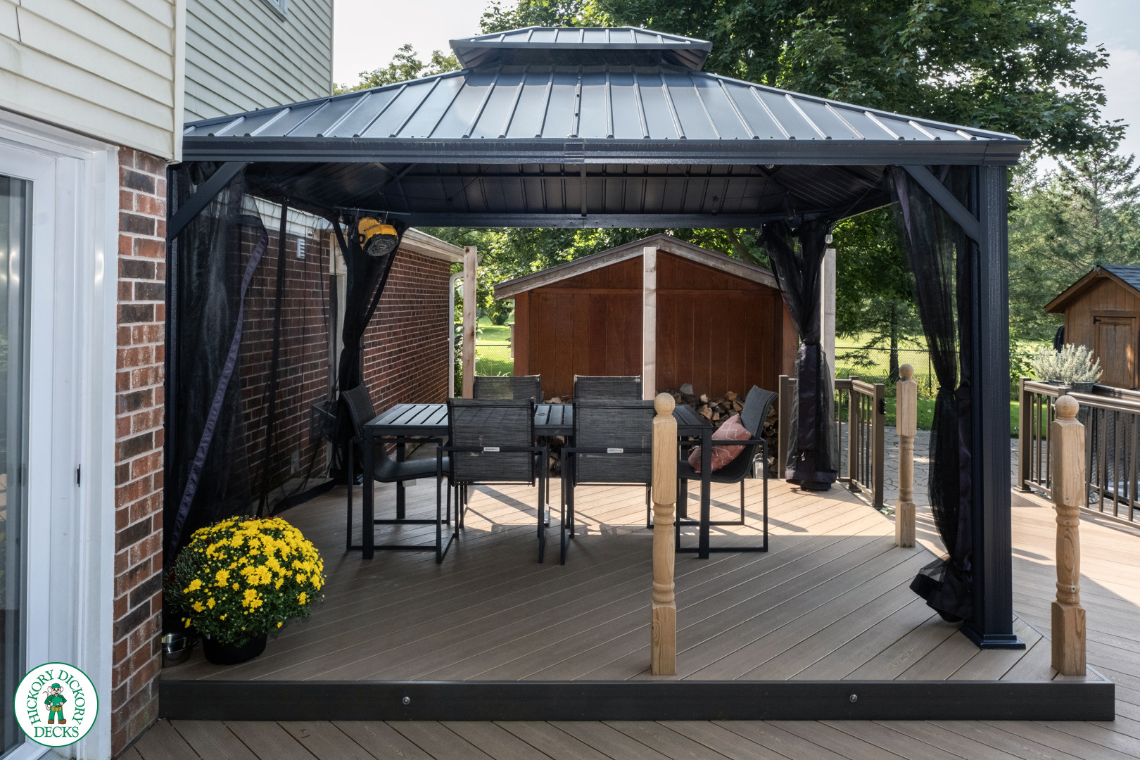 Clubhouse deck with aluminum railing with gate insert for access.