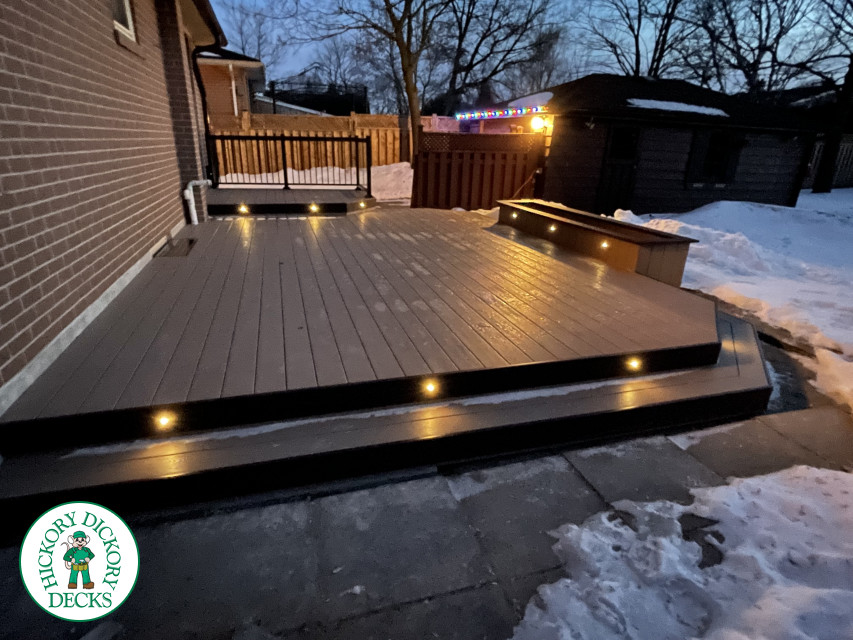 Brown clubhouse deck with lighting in steps.