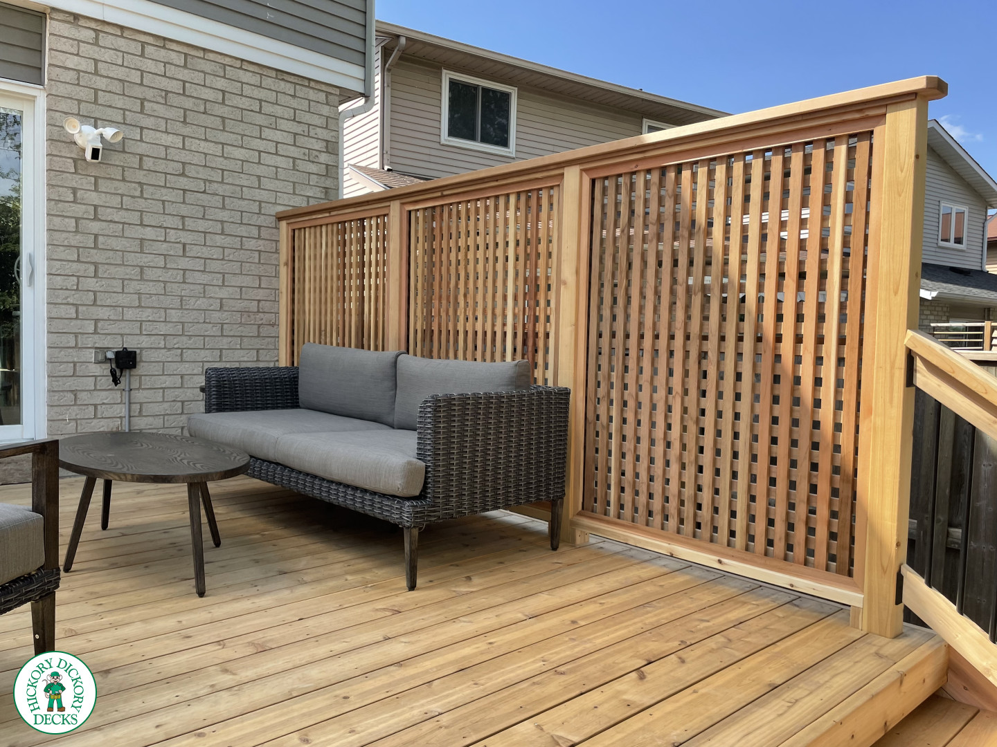 Cedar deck with four steps, cedar pickey railing, and a cedar privacy screen.