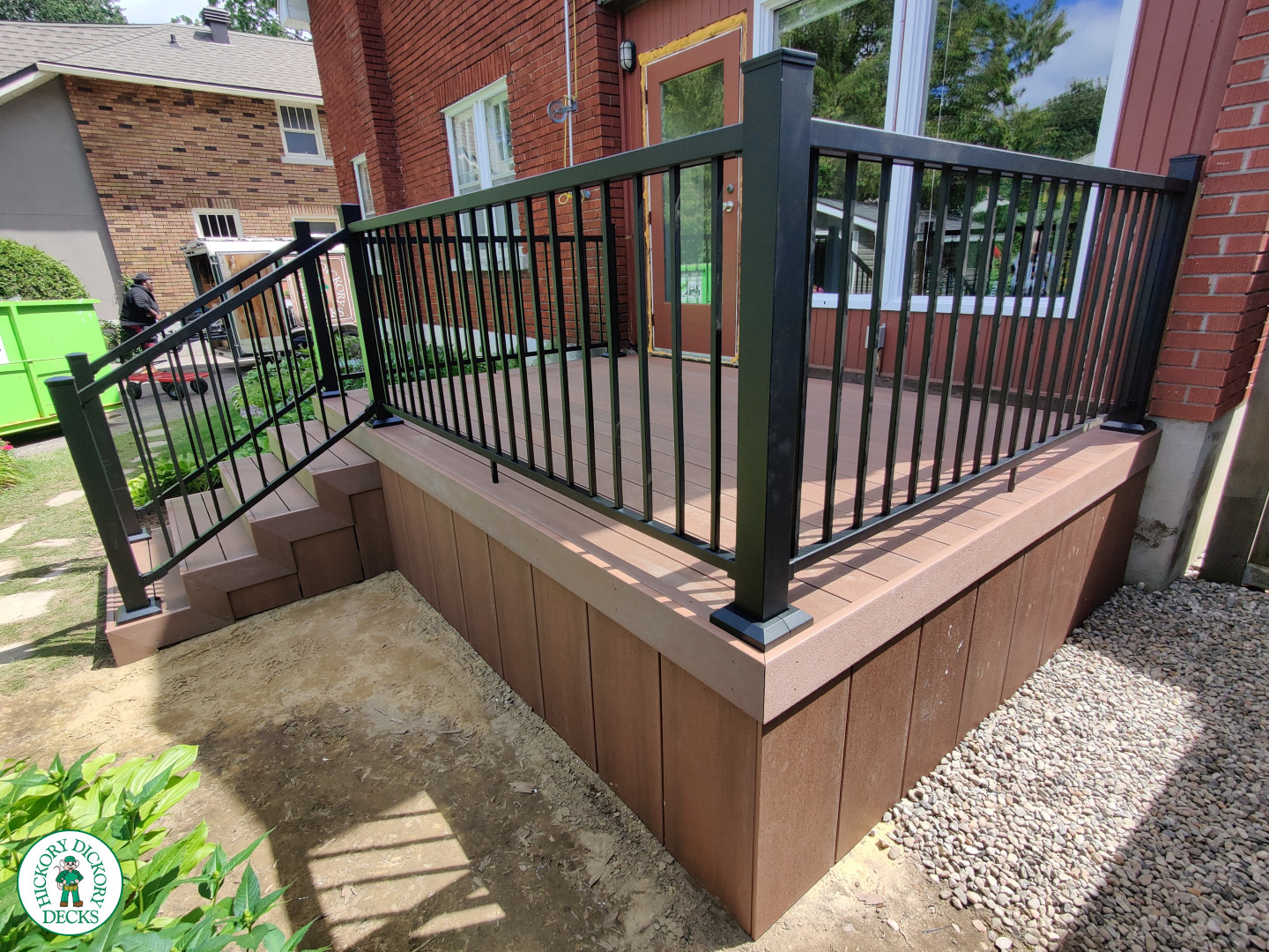 Small brown fiberon deck with black aluminum railing.