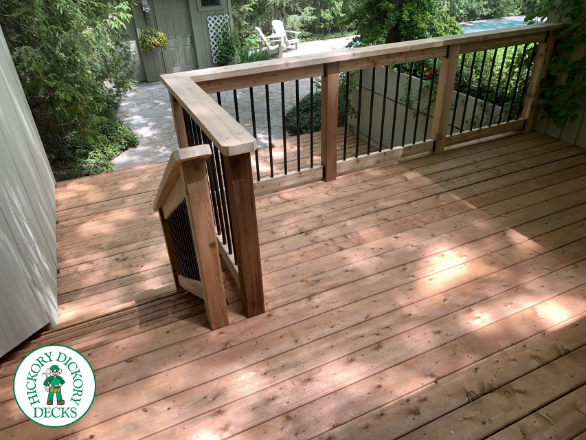 2 level pressure treated deck with picket railings.