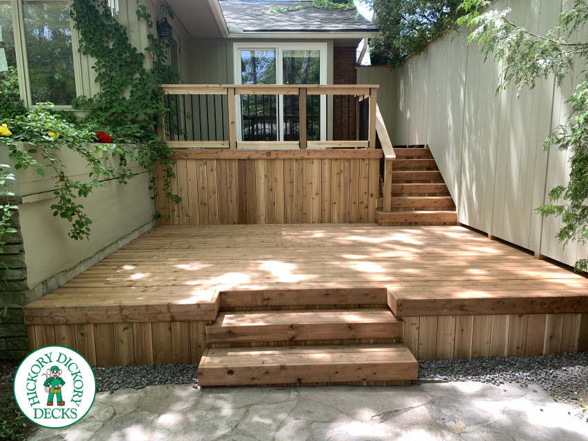 2 level pressure treated deck with picket railings.