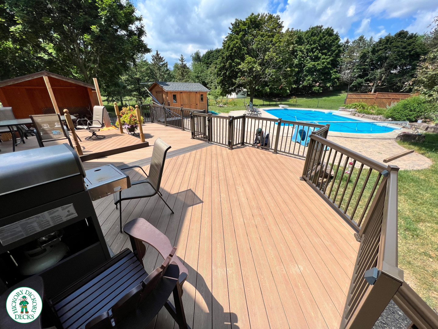 Clubhouse deck with aluminum railing with gate insert for access.