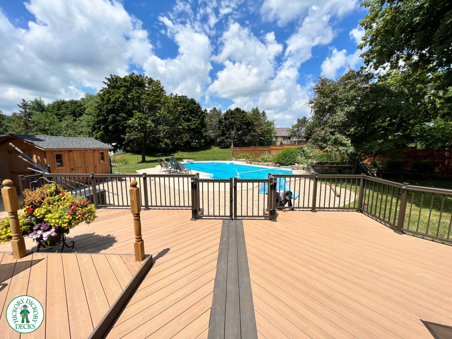 Clubhouse deck with aluminum railing with gate insert for access.