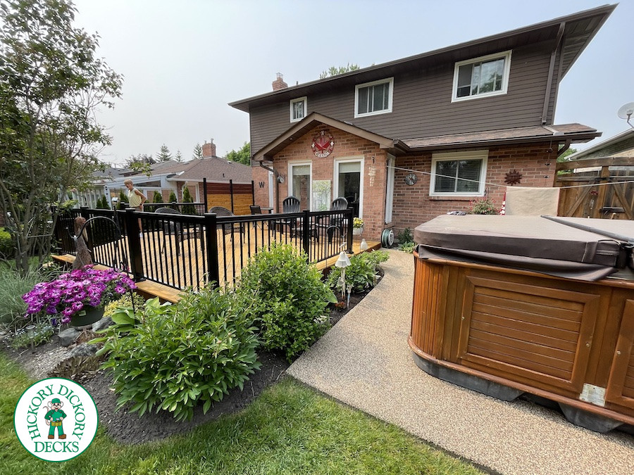 Large cedar deck with stairs, aluminum railing, and a cedar privacy screen.