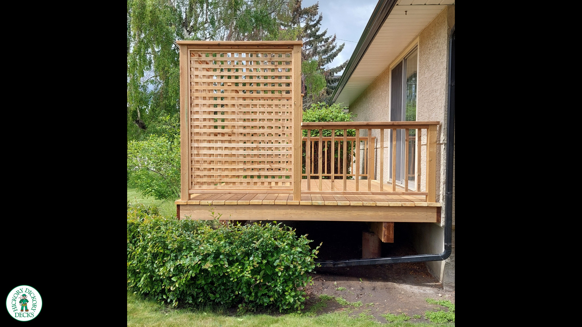 Small pressure treated deck with pressure treated privacy screens and railing.