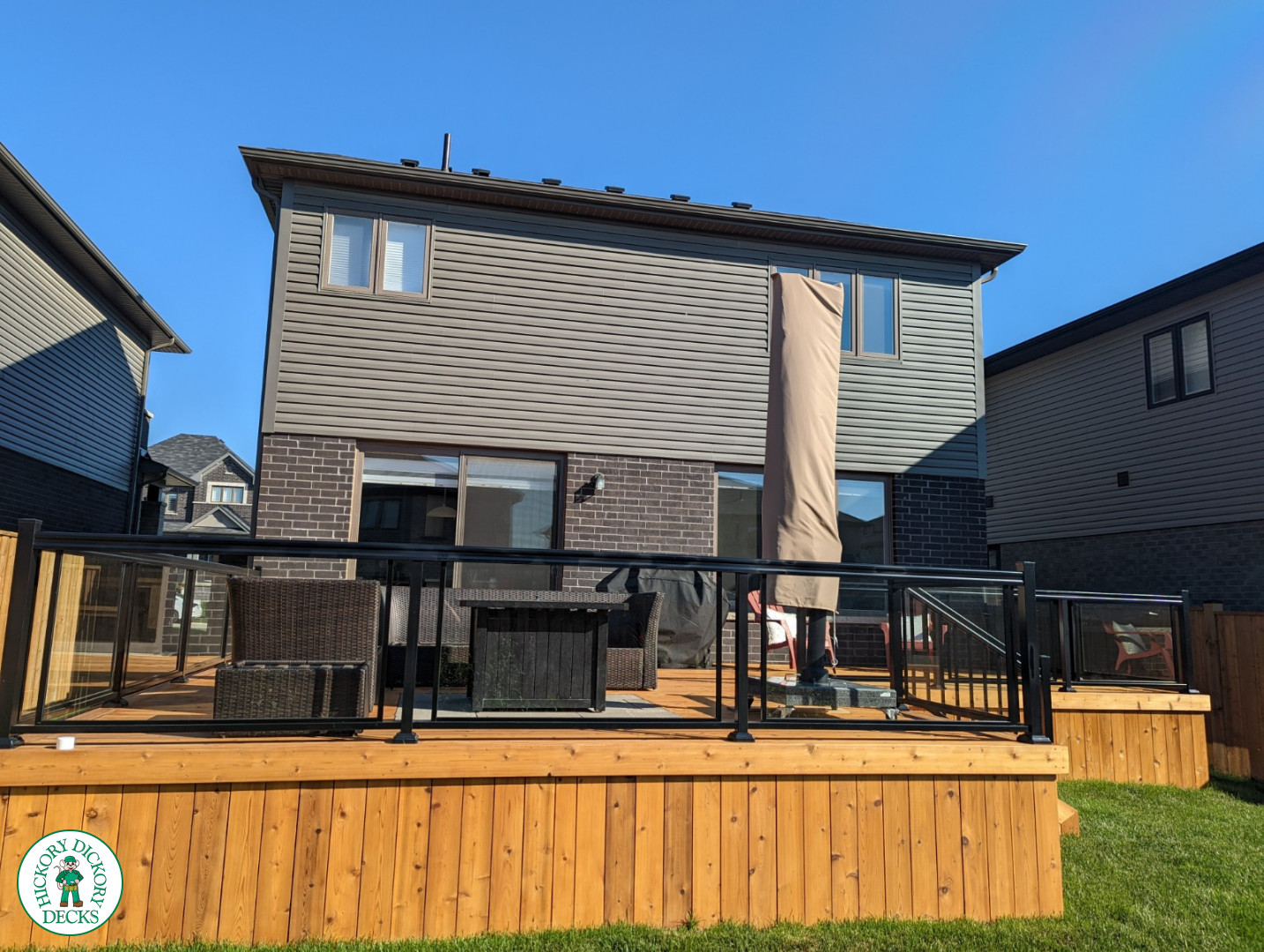 Large cedar deck with stairs, aluminum railing
