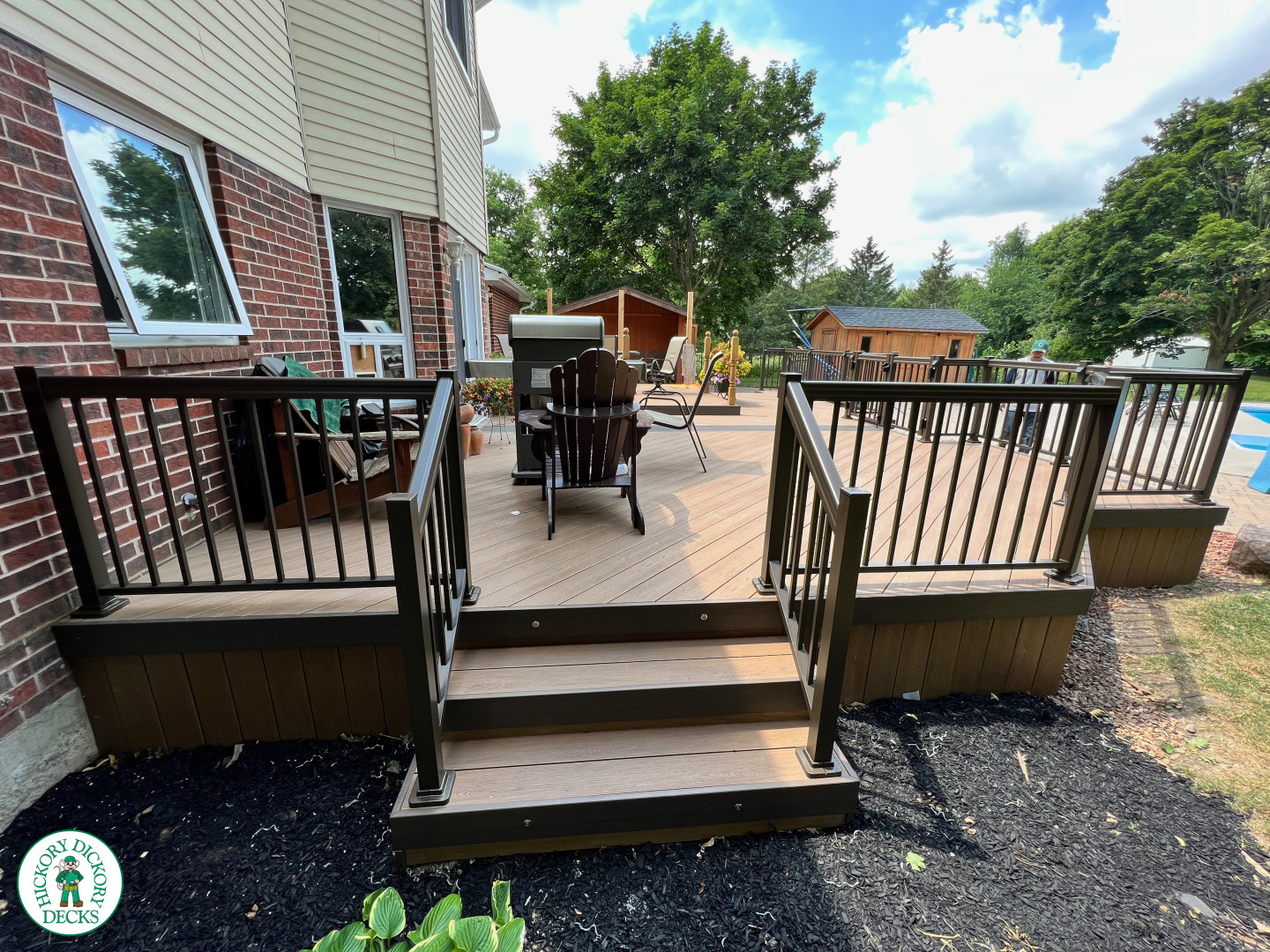 Clubhouse deck with aluminum railing with gate insert for access.