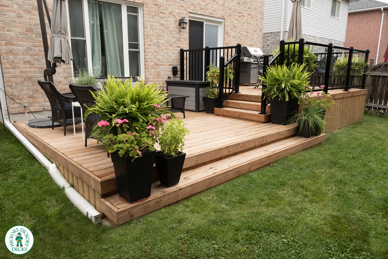 two level cedar deck with aluminum and glass railings